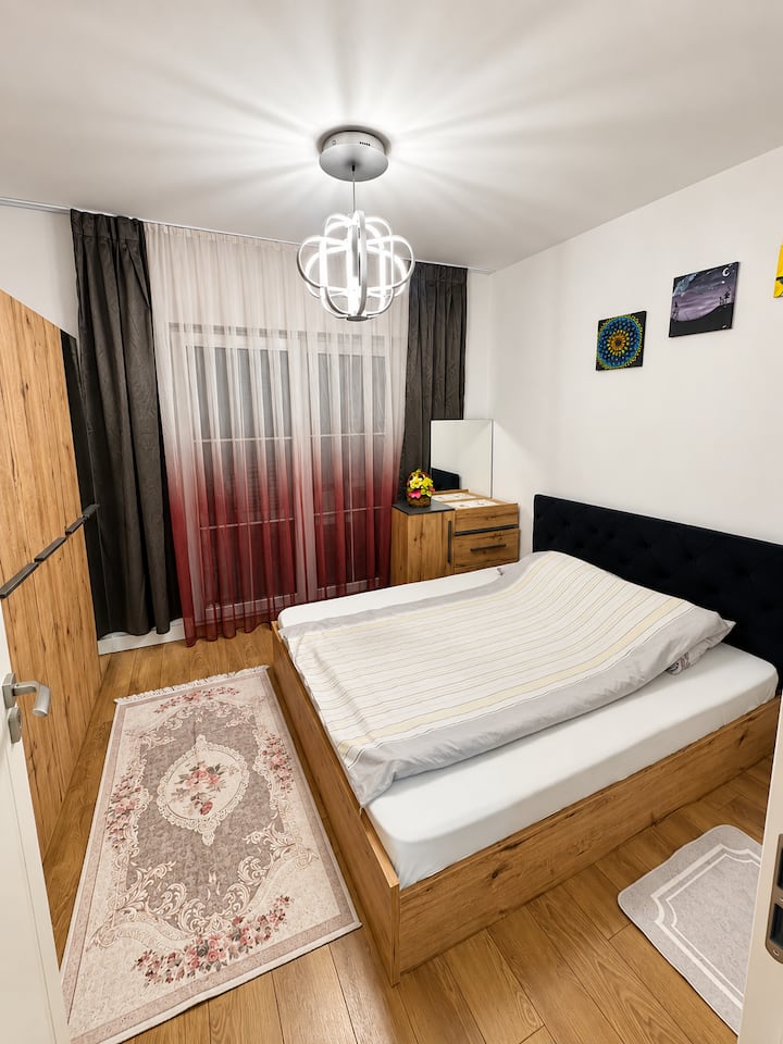 Bedroom with a double bed and wood furnishings at Albanica Residence